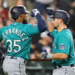 CHICAGO, ILLINOIS - AUGUST 21: Cal Raleigh #29 of the Seattle Mariners celebrates with Teoscar Hernandez #35 after hitting a solo home run off Touki Toussaint #47 of the Chicago White Sox (not pictured)  during the fifth inning at Guaranteed Rate Field on August 21, 2023 in Chicago, Illinois. (Photo by Michael Reaves/Getty Images)