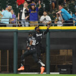 CHICAGO, ILLINOIS - AUGUST 21: Luis Robert Jr. #88 of the Chicago White Sox robs a home run from Mike Ford #20 of the Seattle Mariners (not pictured) during the fifth inning at Guaranteed Rate Field on August 21, 2023 in Chicago, Illinois. (Photo by Michael Reaves/Getty Images)