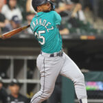 CHICAGO, ILLINOIS - AUGUST 21: Teoscar Hernandez #35 of the Seattle Mariners hits a two-run single against the Chicago White Sox during the sixth inning at Guaranteed Rate Field on August 21, 2023 in Chicago, Illinois. (Photo by Michael Reaves/Getty Images)