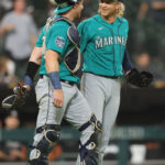 CHICAGO, ILLINOIS - AUGUST 21: Brian O'Keefe #64 and Darren McCaughan #26 of the Seattle Mariners celebrate after defeating the Chicago White Sox 14-2 at Guaranteed Rate Field on August 21, 2023 in Chicago, Illinois. (Photo by Michael Reaves/Getty Images)