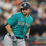 CHICAGO, ILLINOIS - AUGUST 21: Cal Raleigh #29 of the Seattle Mariners reacts after hitting a three-run home run against the Seattle Mariners during the eighth inning at Guaranteed Rate Field on August 21, 2023 in Chicago, Illinois. (Photo by Michael Reaves/Getty Images)