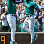 SEATTLE, WASHINGTON - AUGUST 26: Teoscar Hernandez #35 of the Seattle Mariners celebrates with J.P. Crawford #3 after hitting a grand slam home run during the third inning against the Kansas City Royals at T-Mobile Park on August 26, 2023 in Seattle, Washington. (Photo by Alika Jenner/Getty Images)