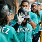 SEATTLE, WASHINGTON - AUGUST 26: Teoscar Hernandez #35 of the Seattle Mariners celebrates with teammates after hitting a grand slam home run during the third inning against the Kansas City Royals at T-Mobile Park on August 26, 2023 in Seattle, Washington. (Photo by Alika Jenner/Getty Images)