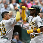 SEATTLE, WASHINGTON - AUGUST 30: Lawrence Butler #22 of the Oakland Athletics celebrates with v13#2 after hitting a two-run home run during the second inning against the Seattle Mariners at T-Mobile Park on August 30, 2023 in Seattle, Washington. (Photo by Alika Jenner/Getty Images)