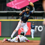 SEATTLE, WASHINGTON - AUGUST 30: Esteury Ruiz #1 of the Oakland Athletics steals second base against J.P. Crawford #3 of the Seattle Mariners during the second inning at T-Mobile Park on August 30, 2023 in Seattle, Washington. (Photo by Alika Jenner/Getty Images)