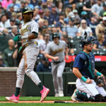 SEATTLE, WASHINGTON - AUGUST 30: Esteury Ruiz #1 of the Oakland Athletics scores off of Ryan Noda #49 hits an RBI double during the second inning against the Seattle Mariners at T-Mobile Park on August 30, 2023 in Seattle, Washington. (Photo by Alika Jenner/Getty Images)