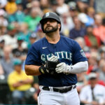 SEATTLE, WASHINGTON - AUGUST 30: Mike Ford #20 of the Seattle Mariners looks on after being hit by a pitch during the fourth inning against the Oakland Athletics at T-Mobile Park on August 30, 2023 in Seattle, Washington. (Photo by Alika Jenner/Getty Images)