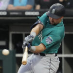 Seattle Mariners' Cal Raleigh hits a two-run double during the first inning of a baseball game against the Chicago White Sox in Chicago, Monday, Aug. 21, 2023. (AP Photo/Nam Y. Huh)Credit: ASSOCIATED PRESS