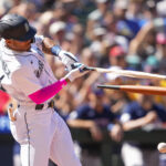 Seattle Mariners' Julio Rodriguez breaks his bat on an RBI single against the Boston Red Sox to score Tom Murphy during the seventh inning of a baseball game, Wednesday, Aug. 2, 2023, in Seattle. (AP Photo/Lindsey Wasson)Credit: ASSOCIATED PRESS
