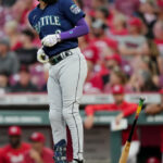 CINCINNATI, OHIO - SEPTEMBER 06: J.P. Crawford #3 of the Seattle Mariners tosses his bat after hitting a home run in the fourth inning against the Cincinnati Reds at Great American Ball Park on September 06, 2023 in Cincinnati, Ohio. (Photo by Dylan Buell/Getty Images)