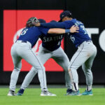 CINCINNATI, OHIO - SEPTEMBER 06: Dominic Canzone #8, Julio Rodríguez #44, and Teoscar Hernández #35 of the Seattle Mariners celebrate after beating the Cincinnati Reds 8-4 at Great American Ball Park on September 06, 2023 in Cincinnati, Ohio. (Photo by Dylan Buell/Getty Images)