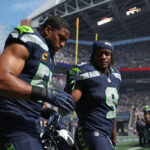 SEATTLE, WASHINGTON - SEPTEMBER 10:  Bobby Wagner #54 and Kenneth Walker III #9 of the Seattle Seahawks take the field prior to the game against the Los Angeles Rams at Lumen Field on September 10, 2023 in Seattle, Washington. (Photo by Steph Chambers/Getty Images)