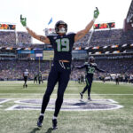 SEATTLE, WASHINGTON - SEPTEMBER 10:  Jake Bobo #19 of the Seattle Seahawks gestures to the fans during the first half against the Los Angeles Rams at Lumen Field on September 10, 2023 in Seattle, Washington. (Photo by Steph Chambers/Getty Images)