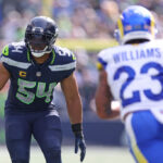 SEATTLE, WASHINGTON - SEPTEMBER 10:  Bobby Wagner #54 of the Seattle Seahawks in play against Kyren Williams #23 of the Los Angeles Rams during the first half at Lumen Field on September 10, 2023 in Seattle, Washington. (Photo by Steph Chambers/Getty Images)