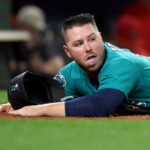 SEATTLE, WASHINGTON - SEPTEMBER 12: Ty France #23 of the Seattle Mariners reacts after he was tagged out at home plate during the first inning against the Los Angeles Angels at T-Mobile Park on September 12, 2023 in Seattle, Washington. (Photo by Steph Chambers/Getty Images)