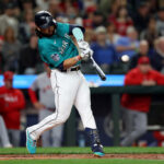SEATTLE, WASHINGTON - SEPTEMBER 12: Eugenio Suarez #28 of the Seattle Mariners hits an RBI single against the Los Angeles Angels during the first inning at T-Mobile Park on September 12, 2023 in Seattle, Washington. (Photo by Steph Chambers/Getty Images)