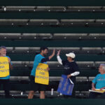SEATTLE, WASHINGTON - SEPTEMBER 12: Fans hold signs supporting Shohei Ohtani during the fifth inning between the Seattle Mariners and the Los Angeles Angels at T-Mobile Park on September 12, 2023 in Seattle, Washington. (Photo by Steph Chambers/Getty Images)