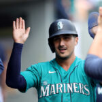 SEATTLE, WASHINGTON - SEPTEMBER 13: Josh Rojas #4 of the Seattle Mariners reacts after his run during the third inning against the Los Angeles Angels at T-Mobile Park on September 13, 2023 in Seattle, Washington. (Photo by Steph Chambers/Getty Images)