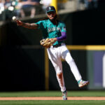 SEATTLE, WASHINGTON - SEPTEMBER 13: J.P. Crawford #3 of the Seattle Mariners makes a play for an out against the Los Angeles Angels during the seventh inning at T-Mobile Park on September 13, 2023 in Seattle, Washington. (Photo by Steph Chambers/Getty Images)