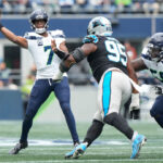 SEATTLE, WASHINGTON - SEPTEMBER 24: Geno Smith #7 of the Seattle Seahawks attempts a pass during the first quarter against the Carolina Panthers at Lumen Field on September 24, 2023 in Seattle, Washington. (Photo by Christopher Mast/Getty Images)