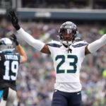 SEATTLE, WASHINGTON - SEPTEMBER 24: Artie Burns #23 of the Seattle Seahawks reacts after a stop during the second quarter against the Carolina Panthers at Lumen Field on September 24, 2023 in Seattle, Washington. (Photo by Steph Chambers/Getty Images)