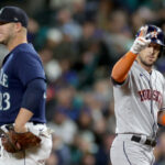 SEATTLE, WASHINGTON - SEPTEMBER 26: Alex Bregman #2 of the Houston Astros celebrates his single next to Ty France #23 of the Seattle Mariners during the first inning at T-Mobile Park on September 26, 2023 in Seattle, Washington. (Photo by Steph Chambers/Getty Images)