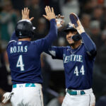 SEATTLE, WASHINGTON - SEPTEMBER 26: Josh Rojas #4 and Julio Rodriguez #44 of the Seattle Mariners celebrate runs during the fifth inning against the Houston Astros at T-Mobile Park on September 26, 2023 in Seattle, Washington. (Photo by Steph Chambers/Getty Images)