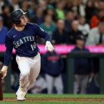 SEATTLE, WASHINGTON - SEPTEMBER 26: Jarred Kelenic #10 of the Seattle Mariners hits a single during the fifth inning against the Houston Astros at T-Mobile Park on September 26, 2023 in Seattle, Washington. (Photo by Steph Chambers/Getty Images)