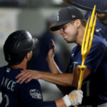 SEATTLE, WASHINGTON - SEPTEMBER 26: Ty France #23 of the Seattle Mariners celebrates his solo home run with Matt Brash #47during the eighth inning against the Houston Astros at T-Mobile Park on September 26, 2023 in Seattle, Washington. (Photo by Steph Chambers/Getty Images)