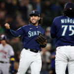 SEATTLE, WASHINGTON - SEPTEMBER 26: Eugenio Suarez #28 of the Seattle Mariners reacts after his throw for an out during the ninth inning against the Houston Astros at T-Mobile Park on September 26, 2023 in Seattle, Washington. (Photo by Steph Chambers/Getty Images)