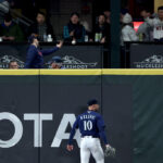 SEATTLE, WASHINGTON - SEPTEMBER 27: Jarred Kelenic #10 of the Seattle Mariners reacts after a home run by Martin Maldonado #15 of the Houston Astros during the eighth inning at T-Mobile Park on September 27, 2023 in Seattle, Washington. (Photo by Steph Chambers/Getty Images)