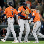 SEATTLE, WASHINGTON - SEPTEMBER 27: Jeremy Pena #3, Yordan Alvarez #44 and Alex Bregman #2 of the Houston Astros celebrate their 8-3 win against the Seattle Mariners at T-Mobile Park on September 27, 2023 in Seattle, Washington. (Photo by Steph Chambers/Getty Images)