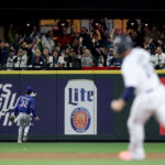 SEATTLE, WASHINGTON - SEPTEMBER 28: Evan Carter #32 of the Texas Rangers watches a walk-off double from J.P. Crawford #3 of the Seattle Mariners during the ninth inning at T-Mobile Park on September 28, 2023 in Seattle, Washington. (Photo by Steph Chambers/Getty Images)