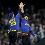 SEATTLE, WASHINGTON - SEPTEMBER 29: Ty France #23 of the Seattle Mariners and Eugenio Suarez #28 celebrate their 8-0 win against the Texas Rangers at T-Mobile Park on September 29, 2023 in Seattle, Washington. (Photo by Steph Chambers/Getty Images)