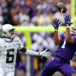 SEATTLE, WASHINGTON - OCTOBER 14: Rome Odunze #1 of the Washington Huskies catches a pass against Jahlil Florence #6 of the Oregon Ducks during the first quarter at Husky Stadium on October 14, 2023 in Seattle, Washington. (Photo by Steph Chambers/Getty Images)