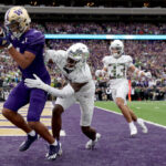 SEATTLE, WASHINGTON - OCTOBER 14: Rome Odunze #1 of the Washington Huskies catches a touchdown pass against the Oregon Ducks during the fourth quarter at Husky Stadium on October 14, 2023 in Seattle, Washington. (Photo by Steph Chambers/Getty Images)
