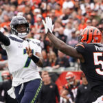 CINCINNATI, OHIO - OCTOBER 15: Geno Smith #7 of the Seattle Seahawks throws the ball against Germaine Pratt #57 of the Cincinnati Bengals during the first quarter at Paycor Stadium on October 15, 2023 in Cincinnati, Ohio. (Photo by Dylan Buell/Getty Images)