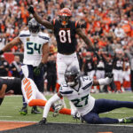 CINCINNATI, OHIO - OCTOBER 15: Tyler Boyd #83 of the Cincinnati Bengals scores a touchdown against Riq Woolen #27 of the Seattle Seahawks during the first quarter at Paycor Stadium on October 15, 2023 in Cincinnati, Ohio. (Photo by Dylan Buell/Getty Images)