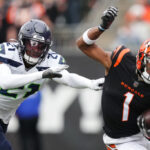 CINCINNATI, OHIO - OCTOBER 15: Ja'Marr Chase #1 of the Cincinnati Bengals runs the ball against Devon Witherspoon #21 of the Seattle Seahawks during the first quarter at Paycor Stadium on October 15, 2023 in Cincinnati, Ohio. (Photo by Dylan Buell/Getty Images)