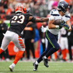 CINCINNATI, OHIO - OCTOBER 15: Jake Bobo #19 of the Seattle Seahawks catches a pass against Dax Hill #23 of the Cincinnati Bengals during the third quarter at Paycor Stadium on October 15, 2023 in Cincinnati, Ohio. (Photo by Dylan Buell/Getty Images)