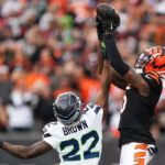 CINCINNATI, OHIO - OCTOBER 15: Tre Brown #22 of the Seattle Seahawks breaks up a pass intended for Tee Higgins #5 of the Cincinnati Bengals during the fourth quarter at Paycor Stadium on October 15, 2023 in Cincinnati, Ohio. (Photo by Dylan Buell/Getty Images)