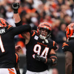 CINCINNATI, OHIO - OCTOBER 15: Trey Hendrickson #91 and Sam Hubbard #94 of the Cincinnati Bengals celebrate with teammates after a sack during the fourth quarter against the Seattle Seahawks at Paycor Stadium on October 15, 2023 in Cincinnati, Ohio. (Photo by Dylan Buell/Getty Images)