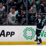 SEATTLE, WASHINGTON - OCTOBER 17: Kailer Yamamoto #56 of the Seattle Kraken celebrates his goal against the Colorado Avalanche during the first period at Climate Pledge Arena on October 17, 2023 in Seattle, Washington. (Photo by Steph Chambers/Getty Images)