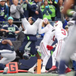 SEATTLE, WASHINGTON - OCTOBER 22: Geno Smith #7 of the Seattle Seahawks dives for the end zone but is stopped short during the third quarter of the game against the Arizona Cardinals at Lumen Field on October 22, 2023 in Seattle, Washington. (Photo by Steph Chambers/Getty Images)