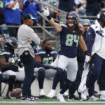 SEATTLE, WASHINGTON - OCTOBER 22: Colby Parkinson #84 of the Seattle Seahawks reacts to a play in the third quarter of the game against the Arizona Cardinals at Lumen Field on October 22, 2023 in Seattle, Washington. (Photo by Steph Chambers/Getty Images)