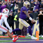 SEATTLE, WASHINGTON - NOVEMBER 11: Michael Penix Jr. #9 of the Washington Huskies scores a touchdown against the Utah Utes during the first quarter at Husky Stadium on November 11, 2023 in Seattle, Washington. (Photo by Steph Chambers/Getty Images)