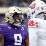 SEATTLE, WASHINGTON - NOVEMBER 11: Michael Penix Jr. #9 of the Washington Huskies celebrates a touchdown during the second quarter against Miles Battle #1 of the Utah Utes at Husky Stadium on November 11, 2023 in Seattle, Washington. (Photo by Steph Chambers/Getty Images)