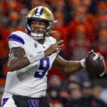 CORVALLIS, OREGON - NOVEMBER 18: Quarterback Michael Penix Jr. #9 of the Washington Huskies passes the ball for a touchdown during the first quarter against the Oregon State Beavers  at Reser Stadium on November 18, 2023 in Corvallis, Oregon. (Photo by Tom Hauck/Getty Images)
