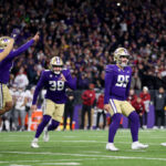 SEATTLE, WASHINGTON - NOVEMBER 25: Grady Gross #95 of the Washington Huskies reacts after kicking the winning field goal against the Washington State Cougars in the 115th Apple Cup at Husky Stadium on November 25, 2023 in Seattle, Washington. (Photo by Steph Chambers/Getty Images)