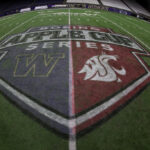 SEATTLE, WASHINGTON - NOVEMBER 25: The Apple Cup logo is seen on the field after the game between the Washington Huskies and the Washington State Cougars at Husky Stadium on November 25, 2023 in Seattle, Washington. (Photo by Steph Chambers/Getty Images)